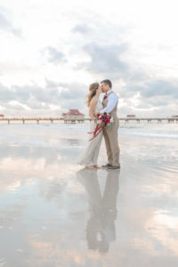 Florida Bride and Groom Sunset Wedding Portrait on the Beach | Tampa Bay Wedding Photographer Lifelong Photography Studios | Clearwater Beach Hotel Wedding Venue Hilton Clearwater Beach