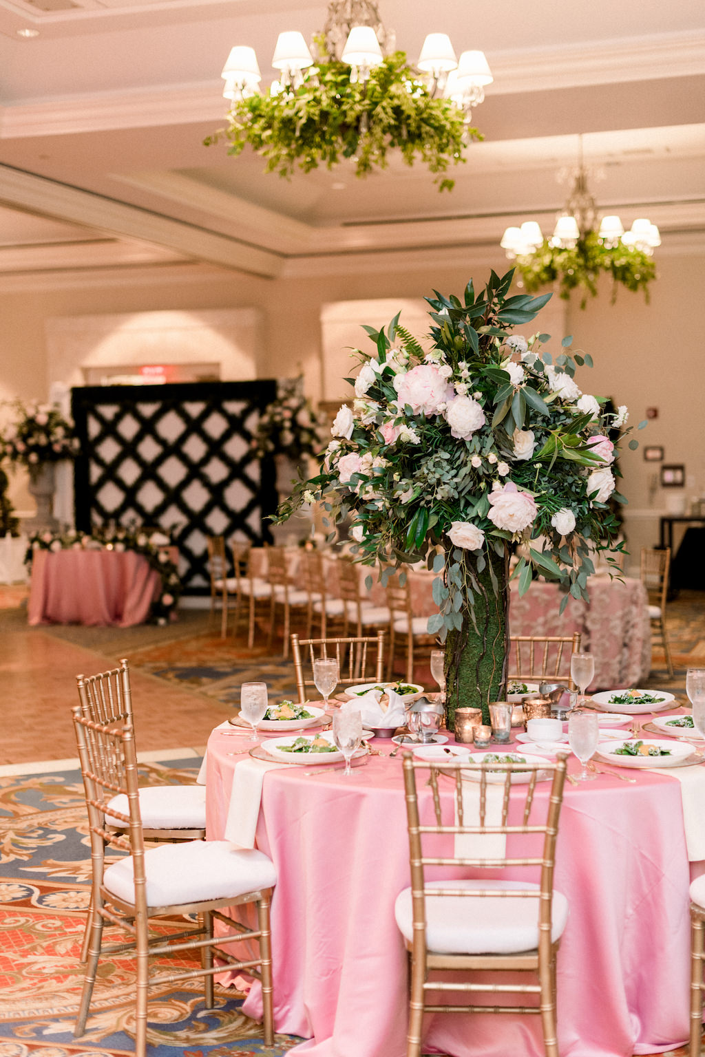 Florida Ballroom Wedding Reception Decor, Round Table with Pink Tablecloth, Gold Chiavari Chairs, Tall Greenery, Ivory and Blush Pink Floral Centerpiece | Wedding Venue Tampa Bay Marriott Waterside | Wedding Rental Company A Chair Affair | Over the Top Rental Linens