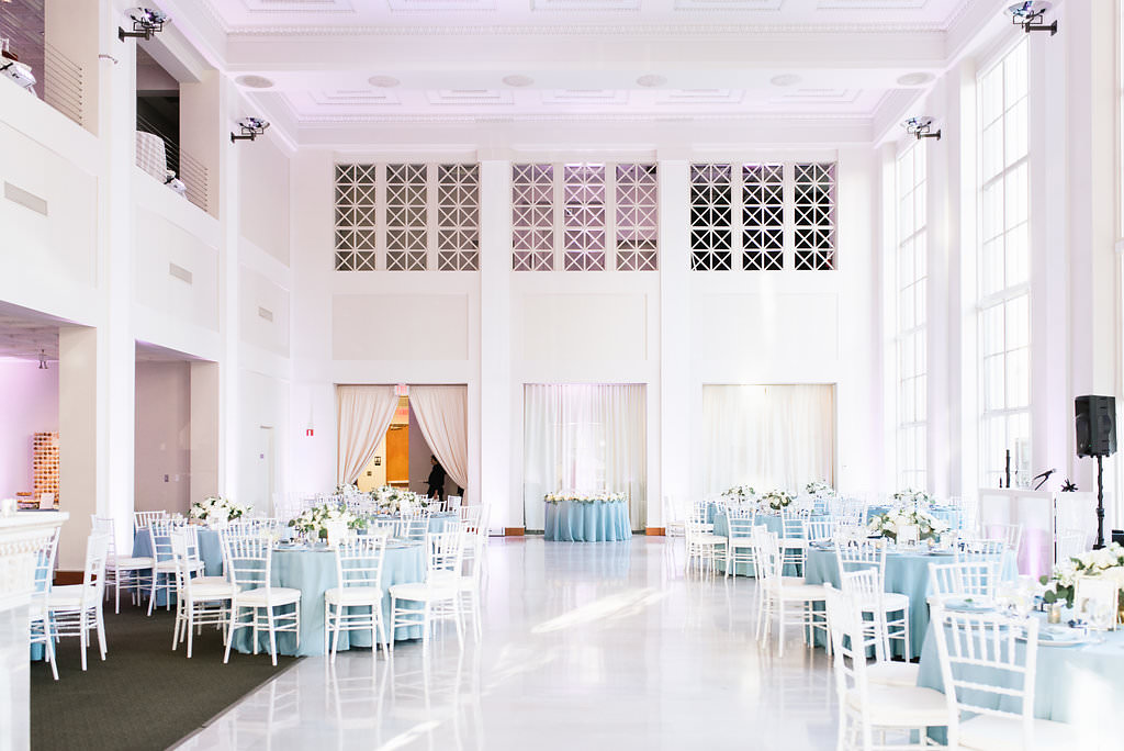 Elegant, Classic White and Dusty Blue Wedding Reception Decor with Round Tables, Dusty Blue Tablecloths, White Chiavari Chairs and Low Centerpieces | Historic Downtown Tampa Wedding Venue The Vault