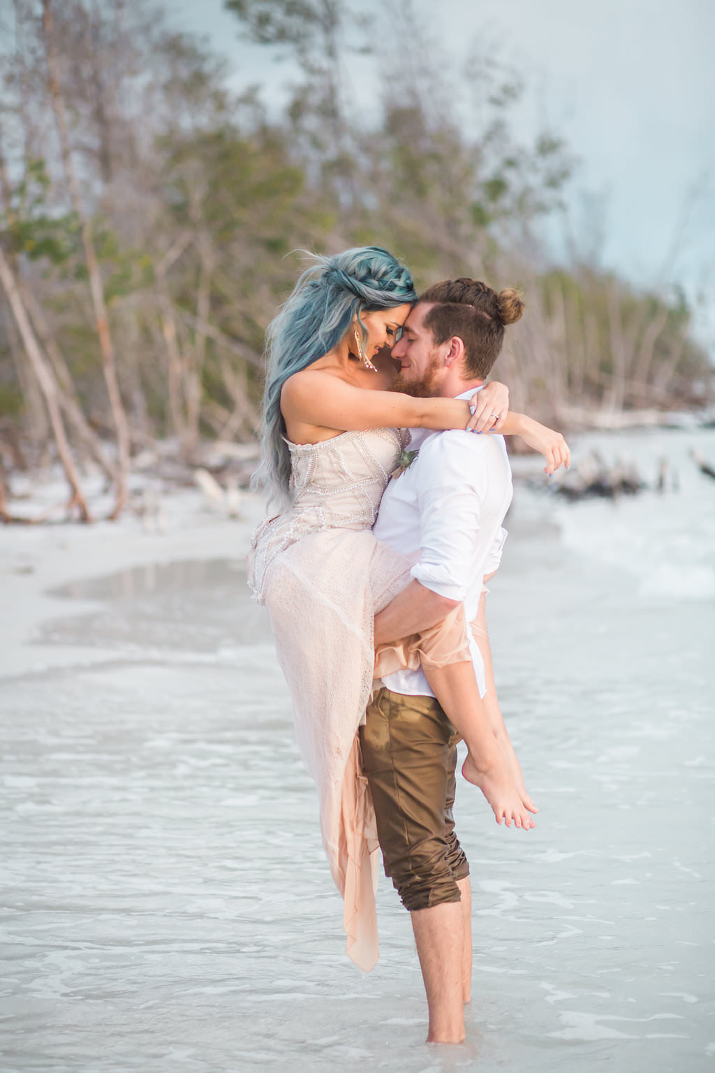 Beachfront Sunset Wedding Styled Shoot Bride And Groom Bride In Nude Sweetheart Neckline Pearl