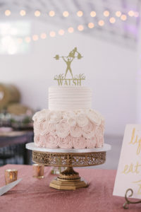 Two Tier White and Blush Pink Ombre Wedding Cake with Frosting Rose Floral Bottom Tier, Gold Custom Cake Topper on Gold Cake Stand