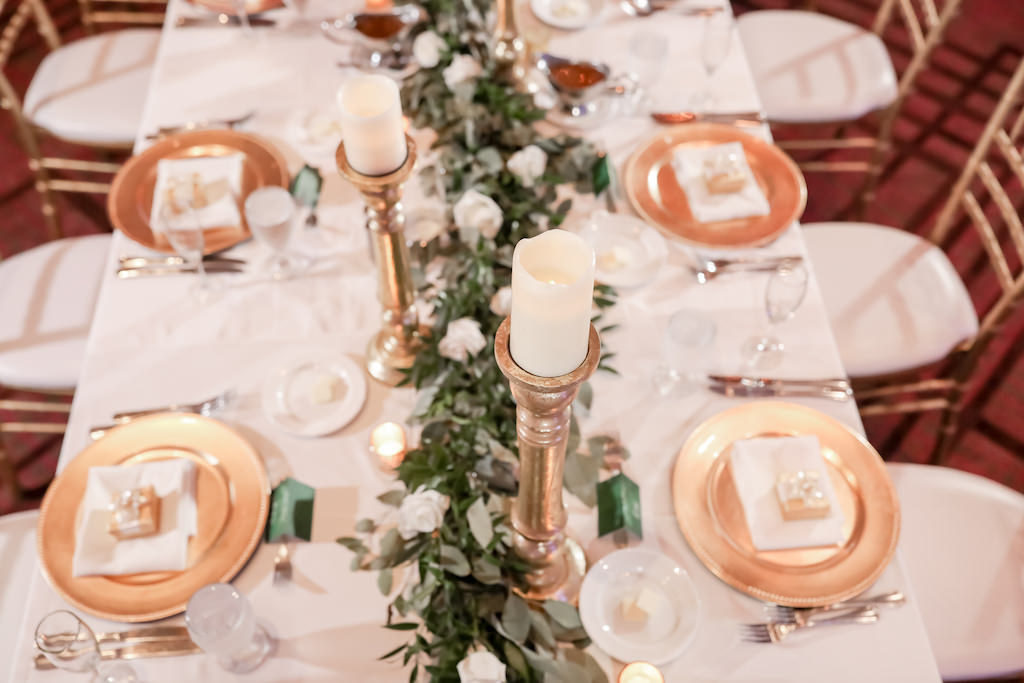 Wedding Reception Decor, Long Feasting Table with White Tablecloth, Gold Chargers, Tall Gold Candlesticks, Greenery Garland | Tampa Bay Wedding Photographer Lifelong Photography Studio