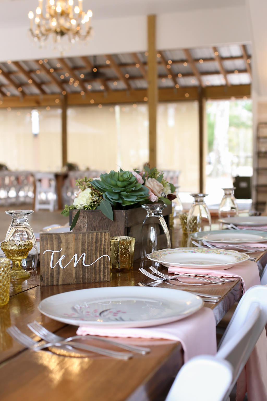 Rustic Inspired Wedding Reception Decor, Long Wooden Feasting Table with Antique China Plates, Blush Pink Linens, Wooden Table Number Sign, Wooden Planter Box with Succulent, Roses and Greenery | Tampa Bay Wedding Photographer Lifelong Photography Studio