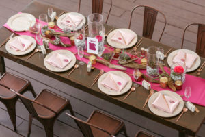 Travel Inspired Wedding Reception Decor, Long Wooden Feasting Table, Bronze Metal Chairs, Hot Pink Table Runner, Wooden Chargers with Blush Pink Linens, Birchwood, Glass Vases with Stones, Succulents and Florals Centerpieces | Tampa Bay Wedding Photographer Lifelong Photography Studios