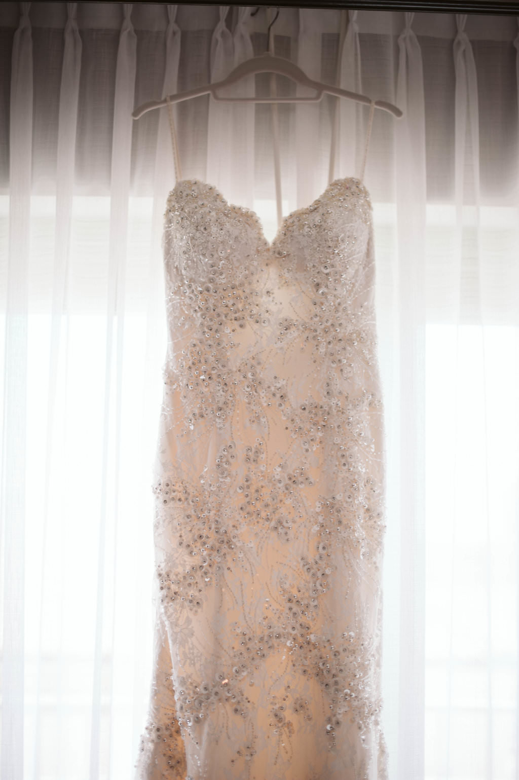 Lace sweetheart wedding dress with rhinestone embellishments