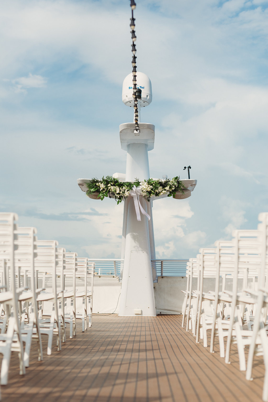 Tampa Outdoor Waterfront Wedding Ceremony Decor, Greenery and White Florals | Tampa Waterfront Wedding Venue Yacht Starship IV