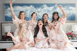 Florida Bride and Bridesmaids Getting Ready Confetti Wedding Portrait in Blush Pink Floral Robes