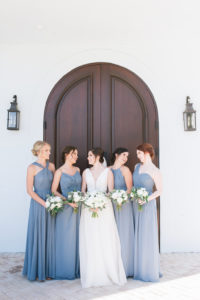 Florida Bride and Bridesmaids Wedding Portrait, Bridesmaids in Dusty Blue, Slate Blue Long Mismatched Style Dresses, Bride in Tank Top Strap, Deep V-Neckline Ball Gown Wedding Dress with White and Greenery Floral Bouquets | Tampa Bay Hair and Makeup Artist Michele Renee the Studio | Safety Harbor Wedding Venue Harborside Chapel