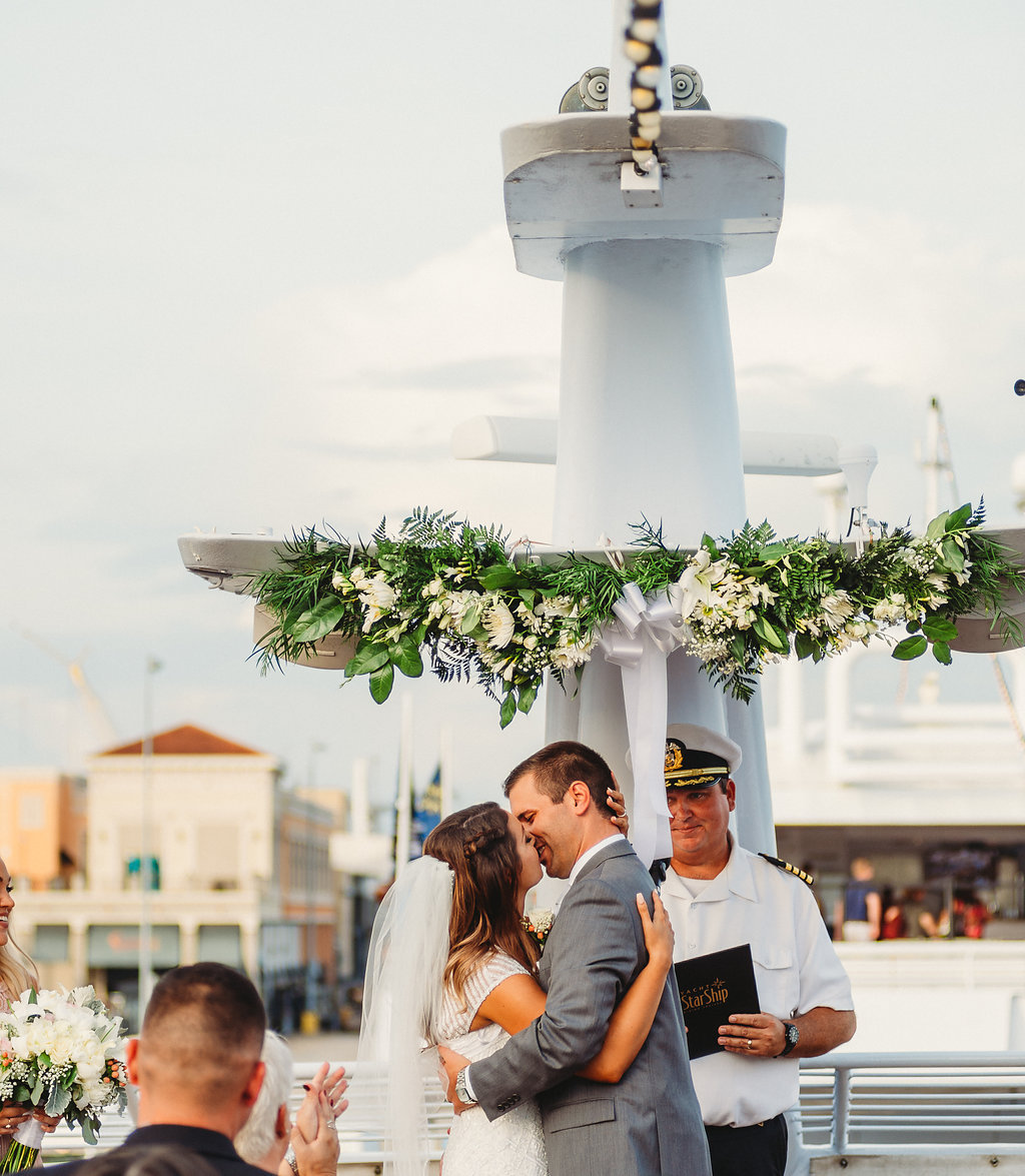 Florida Bride and Groom Wedding Ceremony First Kiss Portrait | Tampa Waterfront Wedding Venue Yacht Starship IV