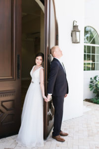 Florida Bride and Groom Holding Hands Before First Look Wedding Portrait | Tampa Bay Hair and Makeup Artist Michele Renee the Studio | Safety Harbor Wedding Venue Harborside Chapel