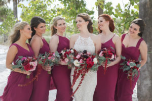 Florida Bride and Bridesmaids Wedding Portrait, Bridesmaids in Pinkish Purple Magenta Long Mismatched Style Dresses, Bride in Long Lace Fitted Halter Strap BHLDN Wedding Dress with Jewel Tone Organic Purple, Pink, Plum, White and Greenery Floral Bouquets | Tampa Bay Wedding Photographer Lifelong Photography Studios | Hair and Makeup Artist Femme Akoi