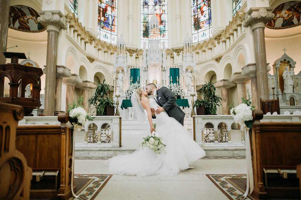 Traditional Bride and Groom Wedding Ceremony First Kiss Portrait | Tampa Bay Wedding Venue Sacred Heart Catholic Church
