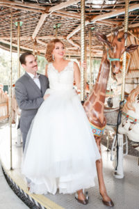 Florida Bride and Groom Riding Carousel Wedding Portrait | Tampa Bay Wedding Photographer Lifelong Photography Studio | Hair and Makeup Michele Renee the Studio | Tampa Unique Wedding Venue ZooTampa at Lowry Park