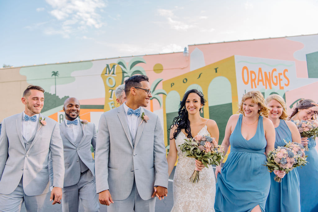 Blue, gray, and pink bridal party in front of downtown St. Pete colorful mural art | Tampa Bay Wedding Photographer Kera Photography