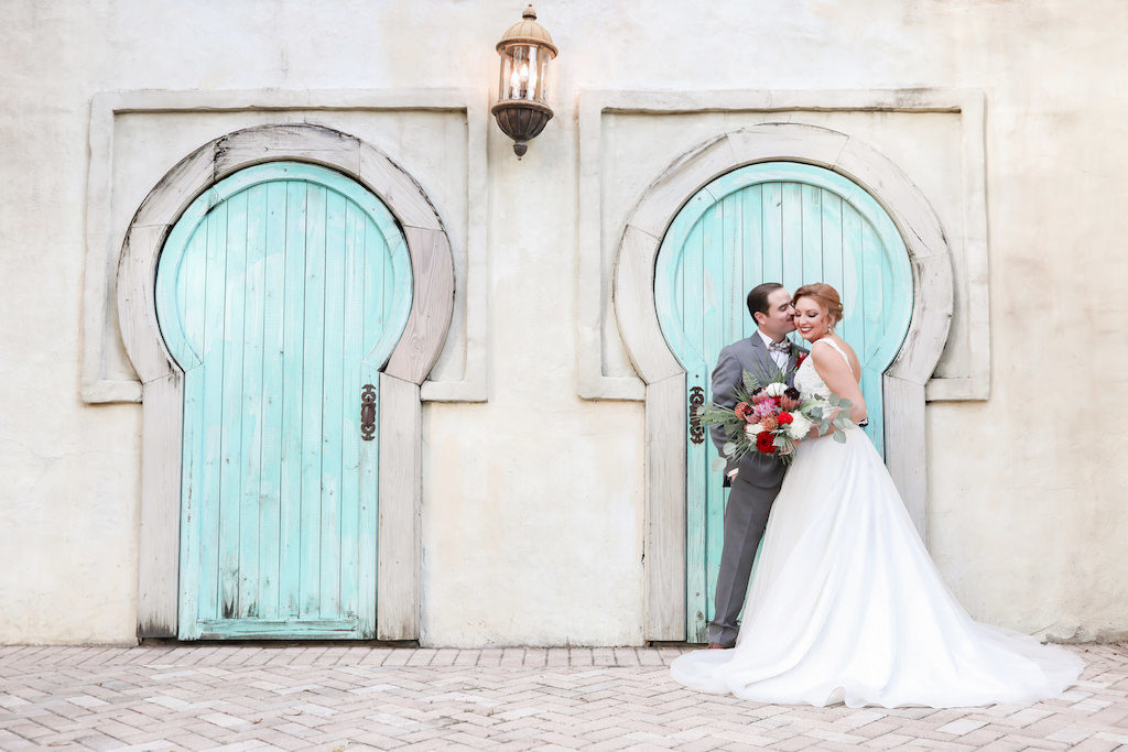 Outdoor Florida Bride and Groom Wedding Portrait with Teal Door Backdrop | Tampa Bay Wedding Photographer Lifelong Photography Studio | Tampa Unique Wedding Venue ZooTampa at Lowry Park | Hair and Makeup Michele Renee the Studio
