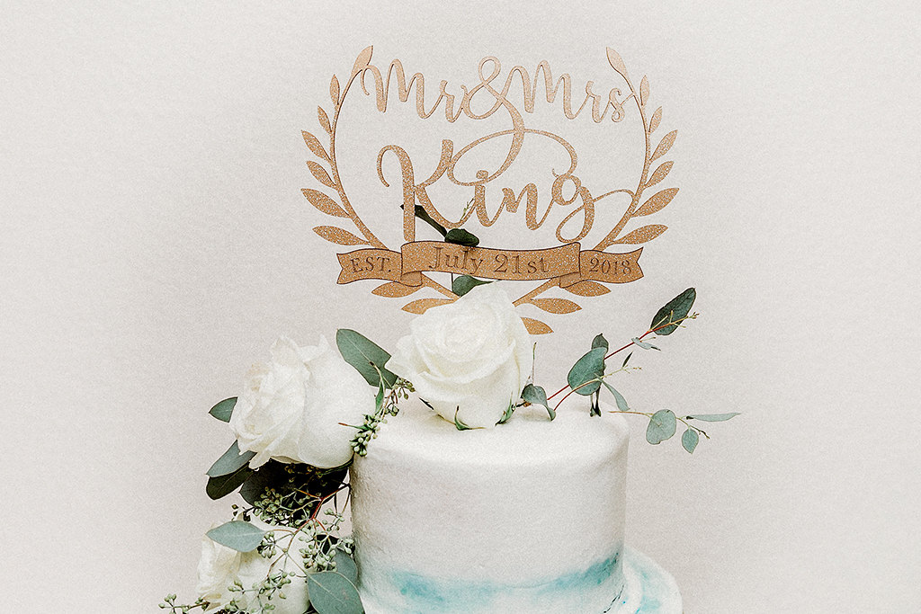 Three Tier White, Aqua Blue, Gold Accents, White Roses and Greenery Cascading Flowers on Gold Vintage Cake Stand with Custom Laser Cut Cake Topper