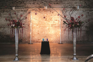 Modern Wedding Ceremony Decor, Tall Silver Pedestal, Vases with Dark Red Hanging Amaranthus, Burgundy and Greenery Floral Arrangement | Tampa Bay Wedding Venue Rialto Theatre | Wedding Planner Kelly Kennedy Weddings and Events