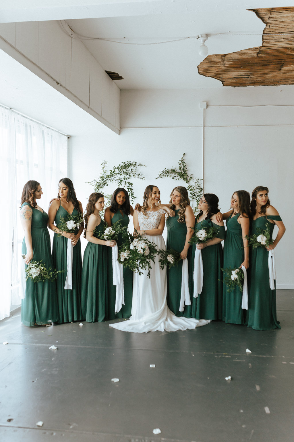 Florida Bride and Bridesmaids Wedding Portrait, Bridesmaids in Green Mismatched Style Dresses | Lakeland Wedding Venue HAUS 820