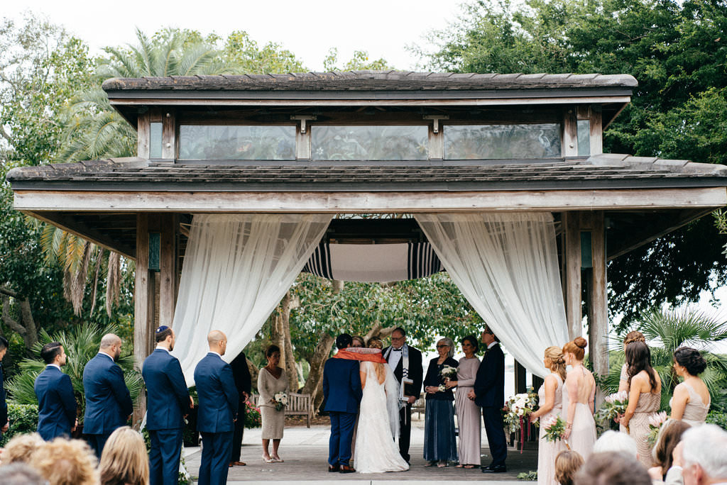 Florida Garden Bride and Groom Exchanging Vows Wedding Ceremony Portrait | Sarasota Wedding Venue Marie Selby Botanical Gardens | Tampa Bay Wedding Planner NK Productions