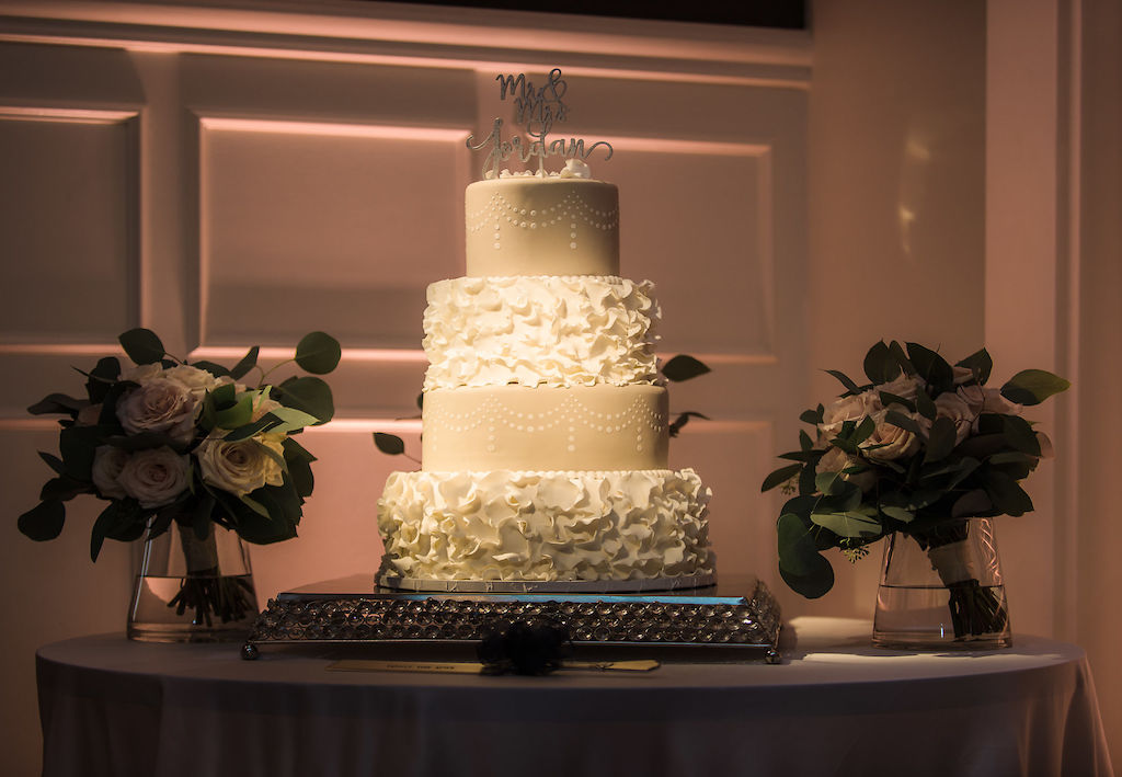 Elegant Four Tier Wedding Cake, Two Ruffle White Layers and Two Pale Gold Layers with Hand Drawn Design, Custom Laser Cut Cake Topper | Pinspot Lighting Spark Weddings