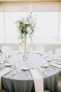 Traditional Classic Wedding Reception Decor, Round Table with Grey Tablecloth, Ivory Linen, Tall Gold Skinny Vase with White and Greenery Floral Centerpiece | Modern Tampa Wedding Venue Centre Club