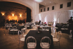 Modern Wedding Reception Decor, Square Tables with Black Tablecloths, Clear Ghost Chairs with White Linens, Low Floral Centerpieces | Tampa Bay Wedding Venue Rialto Theatre | Wedding Planner Kelly Kennedy Weddings and Events