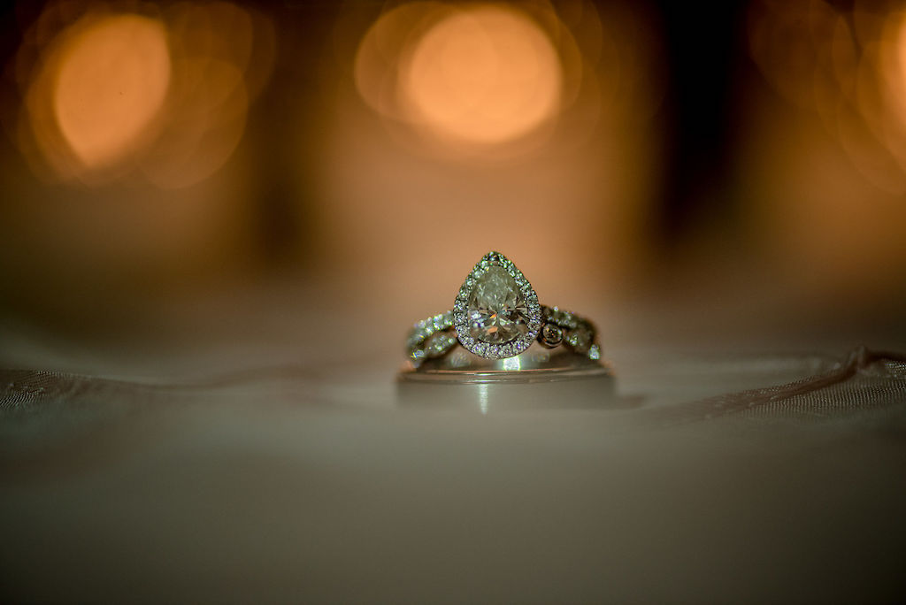 Pear Shaped with Halo Diamond Engagement Ring and Groom Wedding Ring Portrait
