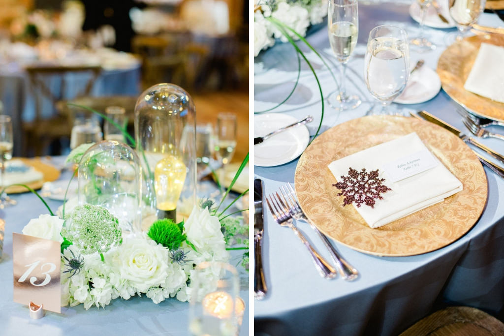 Unique Winter Wonderland Wedding Reception Decor, Satin Light Blue Tablecloth, Gold Chargers, White, Greenery Florals and Glass Cylinders with Lightbulbs Centerpiece, Rose Gold Table Number