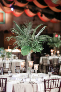 Tropical Inspired Wedding Reception Decor, Round and Long Tables with White Tablecloths, Wooden Chiavari Chairs, Tall Clear Glass Vases with Palm Tree Leaves Centerpieces, Gold Candlesticks with Floating Candles | Tampa Bay Wedding Photographer Lifelong Photography Studio | Tampa Unique Wedding Venue ZooTampa at Lowry Park