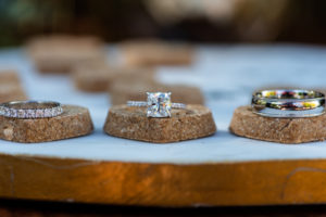Cushion Cut Diamond Engagement Ring and Diamond Band, Bride and Groom Wedding Rings on Dog Biscuits | Tampa Bay Wedding Photographer Caroline and Evan Photography|