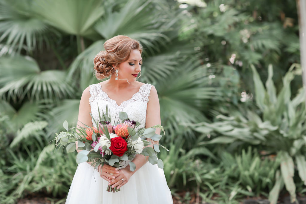 Florida Bride Outdoor Wedding Portrait with Tropical Red, White, Orange, Pink, Greenery Floral Bouquet, Low Back Lace and Illusion Ballgown with Tank Top Straps Wedding Dress | Tampa Bay Wedding Photographer Lifelong Photography Studio | Hair and Makeup Michele Renee the Studio