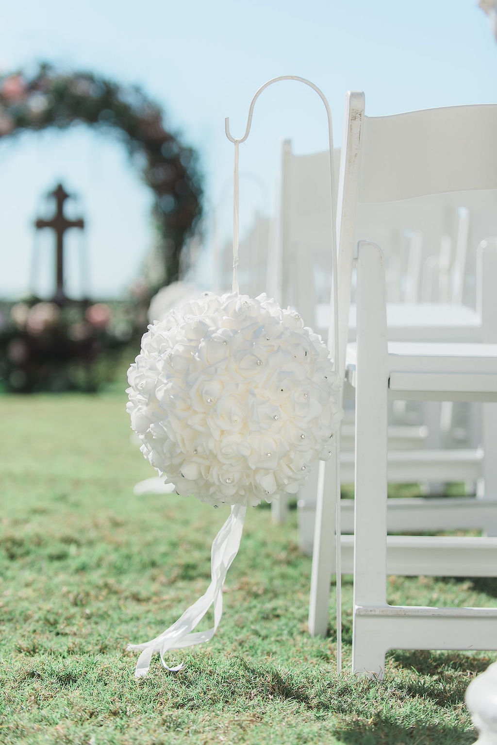 Florida Outdoor Wedding Ceremony Decor, White Folding Chairs with Round White Floral Hanging Bouquets