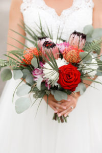 Florida Bride Wedding Portrait Holding Tropical Inspired Floral Bouquet with Red, White, Orange, Pink, Purple, Silver Dollar Eucalyptus and Greenery Floral Bouquet | Tampa Bay Wedding Photographer Lifelong Photography Studio