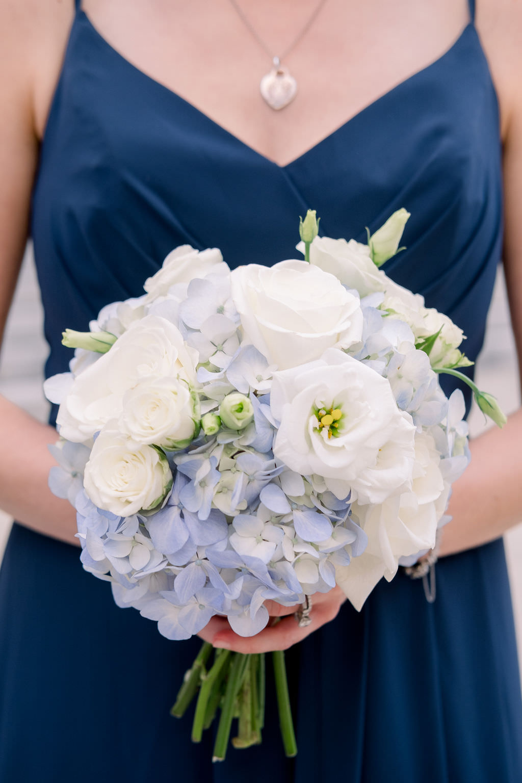 Tampa Bay Bridesmaid in Navy Blue Dress with White, Ivory, Pale Blue Floral Bouquet | Tampa Wedding Planner Breezin Entertainment