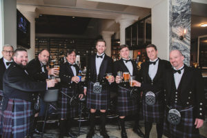 Tampa Bay Groom and Groomsmen Wedding Portrait in Black Suit Jackets and Black and Grey Kilts