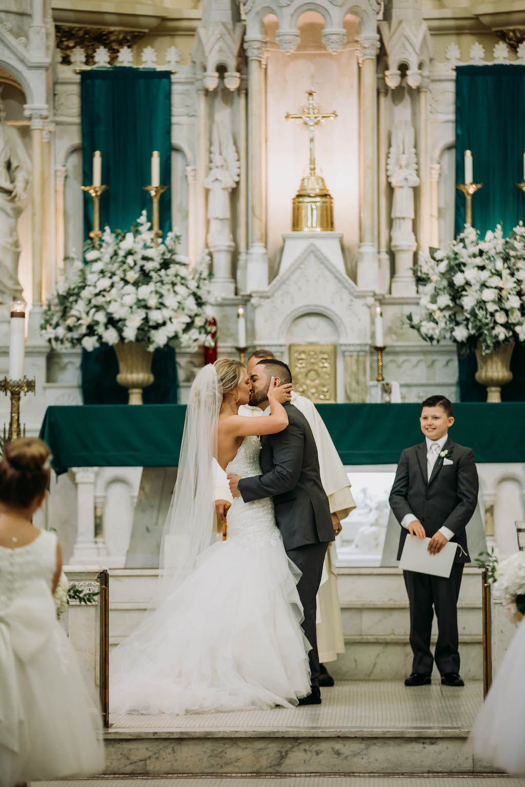 Traditional Bride and Groom Wedding Ceremony First Kiss Portrait | Tampa Bay Wedding Venue Sacred Heart Catholic Church