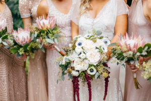 Boho Chic Tampa Bay Bride with Garden Inspired Ivory Garden Rose, White Anemones, Red Hanging Amaranthus, Greenery Flower Bouquet, Brides in Mismatched Blush Dresses with King Protea and Greenery Bouquets | =