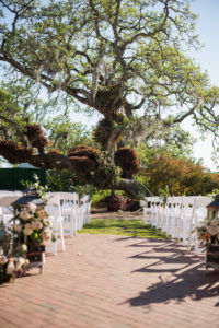 Outdoor Garden Wedding Ceremony Decor, White Folding Chairs | Sarasota Wedding Venue Marie Selby Botanical Gardens