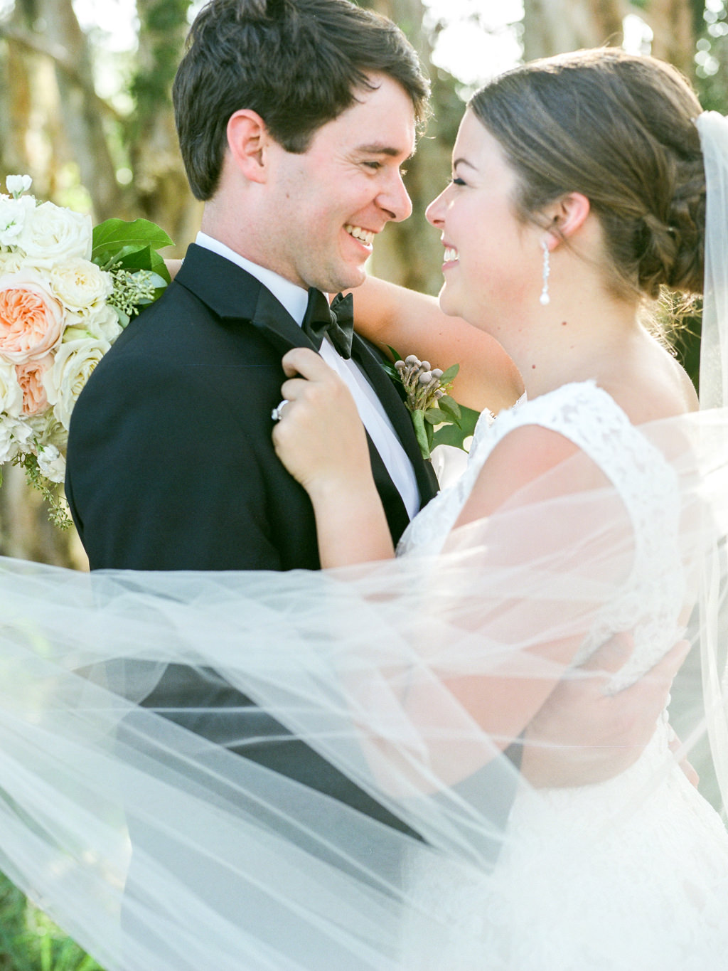 Creative Bride and Groom with Veil Blowing in the Wind Wedding Portrait