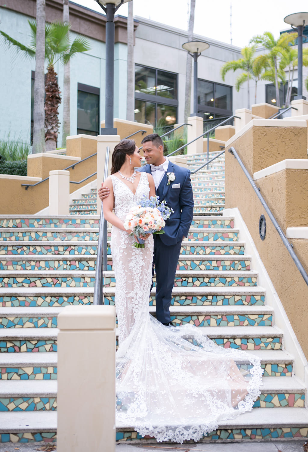 Florida Bride and Groom Staircase Wedding Portrait | Tampa Bay Photographer Carrie Wildes Photography | Hair and Makeup Destiny and Light Hair and Makeup Group | Wedding Attire Nikki's Glitz and Glam Boutique | Florist Gabro Event Services | Hotel Wedding Venue Renaissance Tampa International Plaza