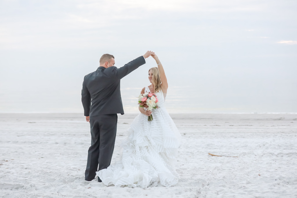 St. Pete Beach Bride and Groom Dancing on the Beach Wedding Portrait | Tampa Bay Wedding Photographer Lifelong Photography Studios | Wedding Dress Shop Truly Forever Bridal