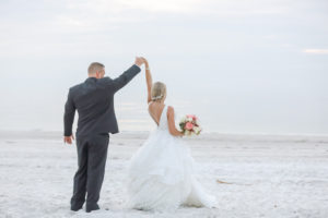 St. Pete Beach Bride and Groom Dancing on the Beach Wedding Portrait | Tampa Bay Wedding Photographer Lifelong Photography Studios | Wedding Dress Shop Truly Forever Bridal