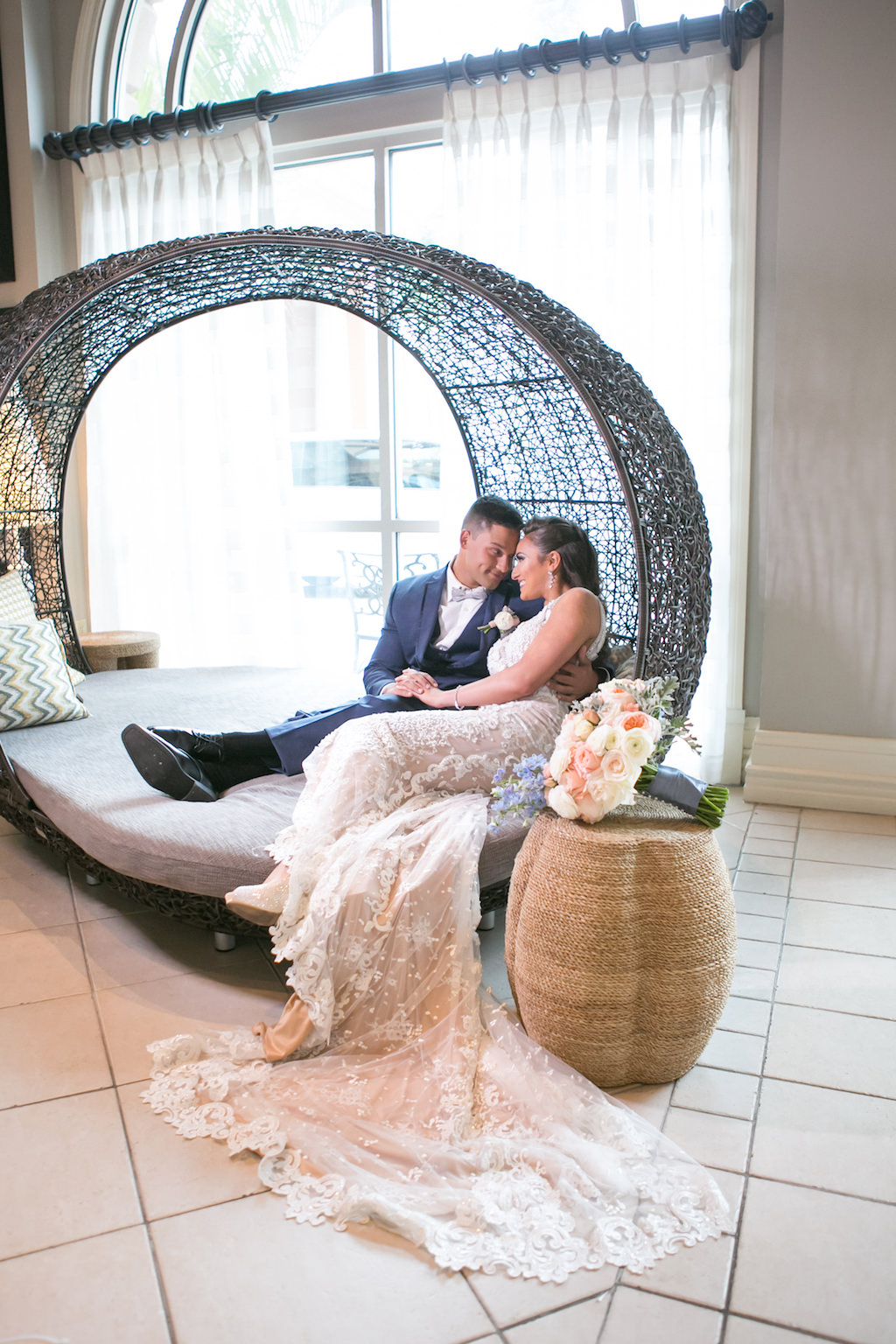 Florida Bride and Groom Wedding Portrait in Round Lounge Chair | Tampa Bay Photographer Carrie Wildes Photography | Hotel Wedding Venue Renaissance Tampa International Plaza
