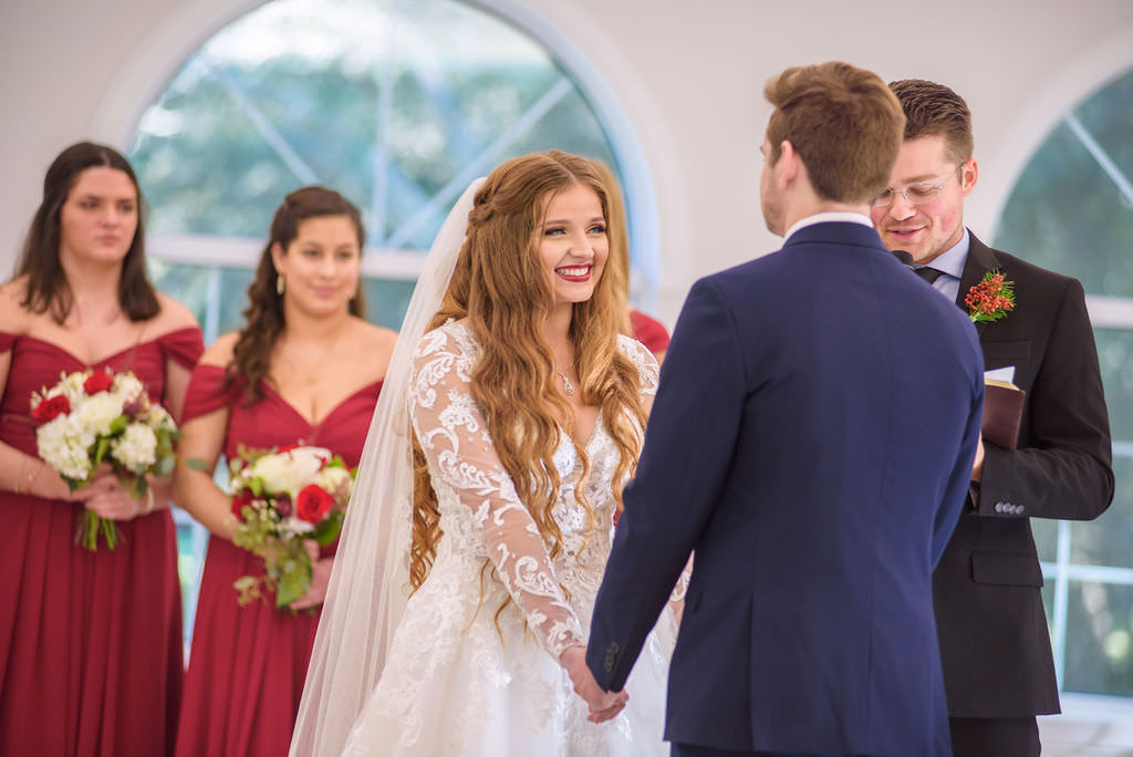 Tampa Bay Bride and Groom Exchanging Vows During Christmas Inspired Wedding Ceremony