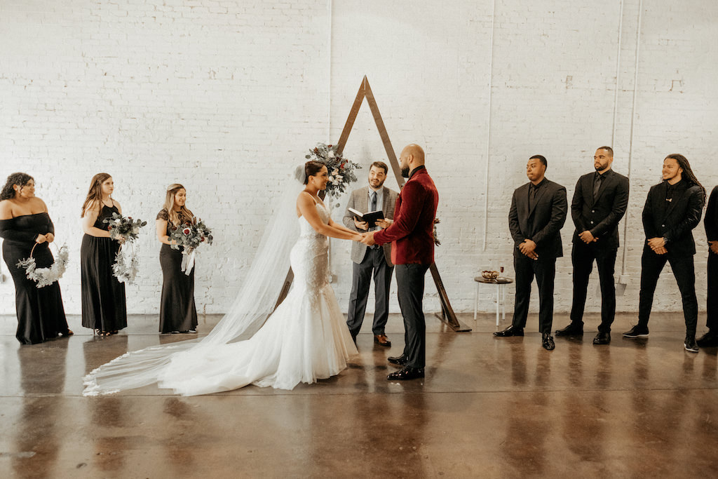 Florida Bride and Groom Exchanging Vows Wedding Ceremony Portrait | Lakeland Industrial Modern Wedding Venue and Event Space Haus 820