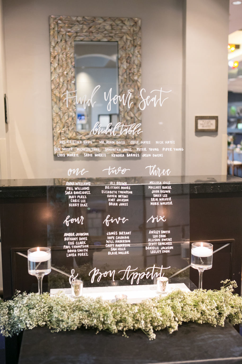 Wedding Reception Decor, Clear Acrylic Wedding Seating Chart with White Font, White Baby's Breathe Garland, Glass Candlesticks with Floating Candles | Tampa Bay Photographer Carrie Wildes Photography | Wedding Planner Coastal Coordinating | Rentals and Florist Gabro Event Services