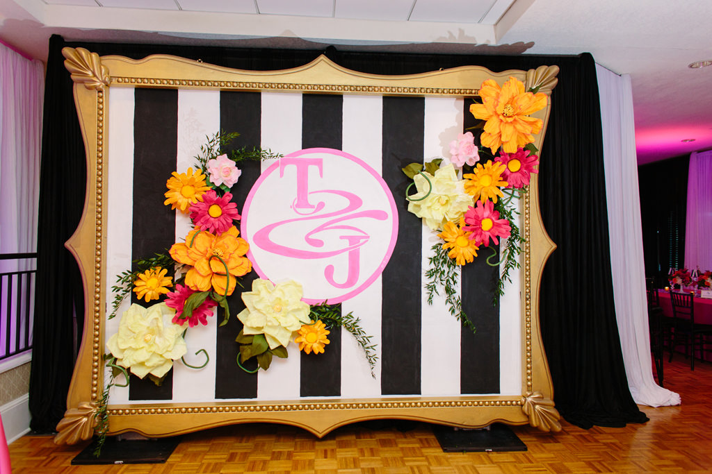 Whimsical Kate Spade Inspired Wedding Reception Decor, Large Gold Frame with Black and White Stripes, Pink Monogram, Colorful Paper Flowers | Tampa Bay Wedding Planner Parties A La Carte