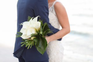 Tampa Bay Bride and Groom Waterfront Wedding Portrait, Bride with White Tropical Cala Lily and Palm Leaf Floral Bouquet | Photographer LifeLong Photography Studios