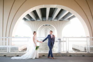 St. Pete Beach Waterfront Bride and Groom Wedding Portrait Under Bridge | Photographer LifeLong Photography Studios