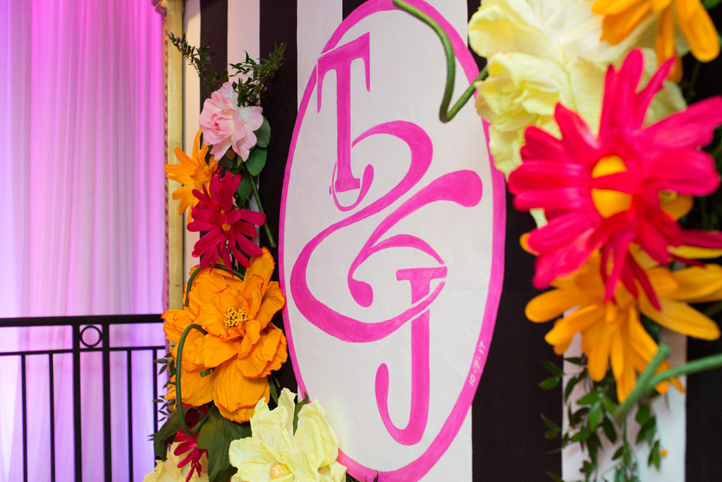 Whimsical Kate Spade Inspired Wedding Reception Decor, Large Gold Frame with Black and White Stripes, Pink Monogram, Colorful Paper Flowers | Tampa Bay Wedding Planner Parties A La Carte